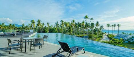 2 outdoor pools, open 6:00 AM to 10:00 PM, pool umbrellas