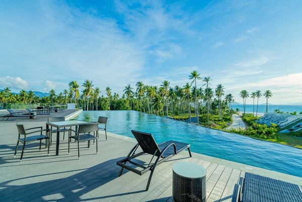 2 outdoor pools, open 6:00 AM to 10:00 PM, pool umbrellas