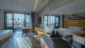Junior Suite, Multiple Beds, Beach View | Minibar, desk, free WiFi, bed sheets