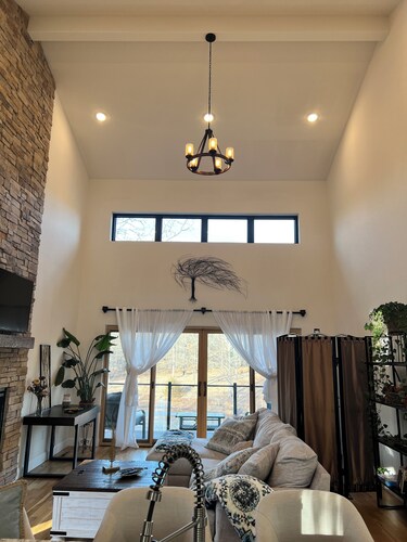 Beautiful Modern mountain getaway overlooking water with fountain.