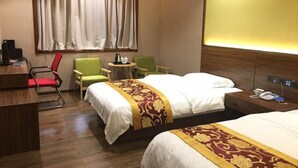 A hotel room with two beds, a desk, a chair, a small table, and a window with curtains. - Sheraton Pingli Hotel (Pingli)