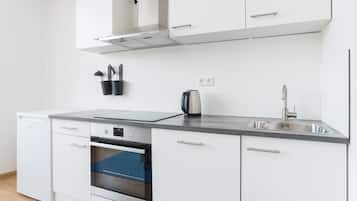 Fridge, dishwasher, coffee/tea maker, cookware/dishes/utensils