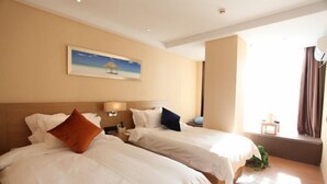 A hotel room with two beds, a painting on the wall, and a window with curtains. - PRETTY BANK HOTEL (Taiyuan)
