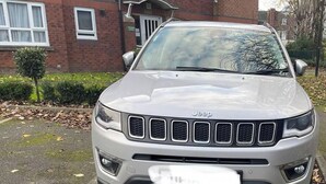 A silver SUV parked in front of a brick house with a window and a door. - Princess Gardens Liverpool Accessible - Infinity (Liverpool)