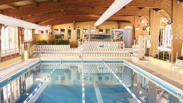 Indoor pool, pool umbrellas, sun loungers