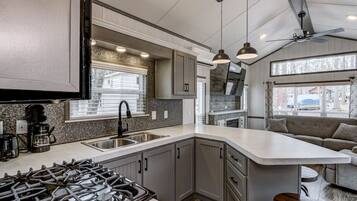 Fridge, microwave, cookware/dishes/utensils