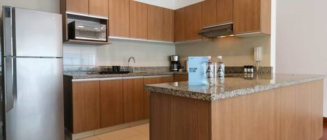 Fridge, microwave, stovetop, coffee/tea maker