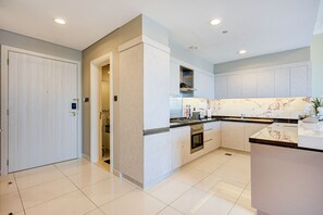 Deluxe Apartment | Private kitchen | Full-size fridge, microwave