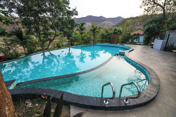 Outdoor pool, pool umbrellas, pool loungers