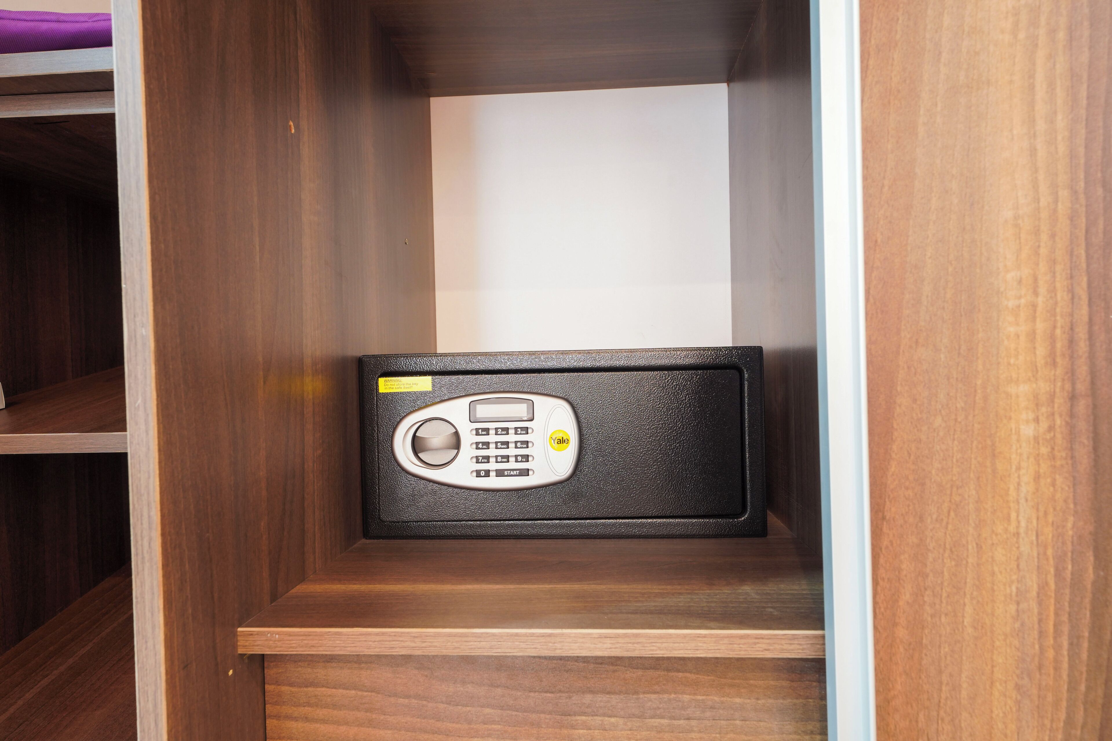 A wooden cabinet with a radio inside.