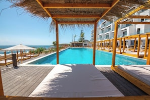Seasonal outdoor pool, pool umbrellas, pool loungers