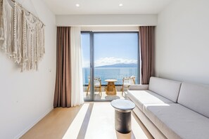Panoramic Sea View Suite with Bath Tub | Living area | 42-cm Smart TV with satellite channels - San Angelo Luxury Resort & Spa - Adults Only (Sarandë)