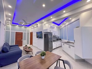 A modern kitchen with white cabinets, a built-in microwave, and a refrigerator. - Plaza Achim 7, Luxury Apt 250m From Sosua Beach! (Sosúa)