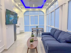 Departamento, 1 habitación, Terraza, vista a la ciudad | Área de sala de estar