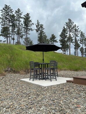Outdoor dining - Escape to our modern, new-construction condo in the heart of the Black Hills! This tranquil retreat comfortably sleeps 2 and is your perfect home base for adventure. Enjoy a private patio, high-speed Wi-Fi, and a fully equipped kitchen. (Rockerville)