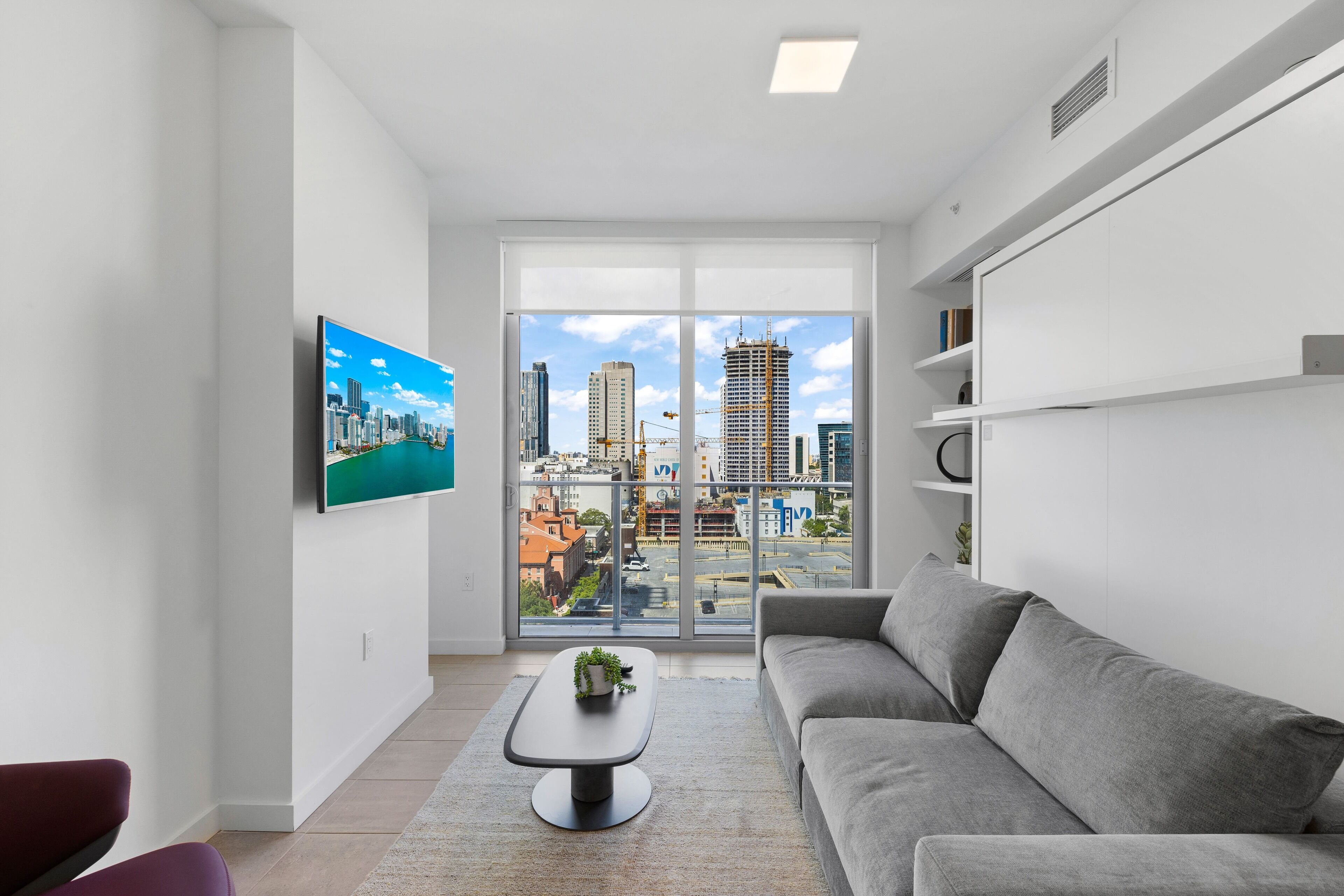 Deluxe Condo | Living area | 50-inch Smart TV with cable channels