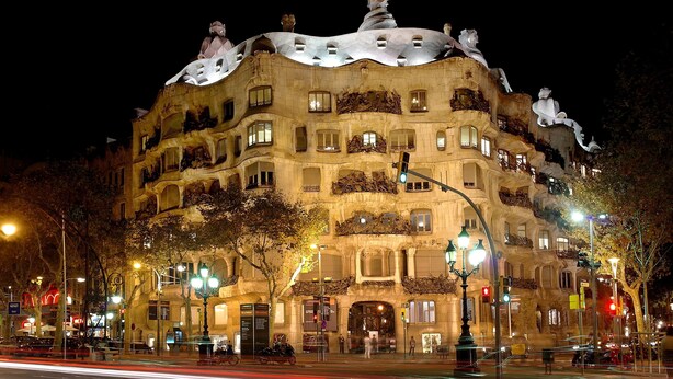 A historic building with ornate balconies and a unique architectural style, featuring multiple levels and a curved facade. - Bright and Quiet Duplex Apartment (Barcelona)