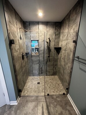 Shower, hair dryer, towels, soap