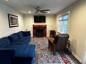 Smart TV, fireplace, DVD player, books