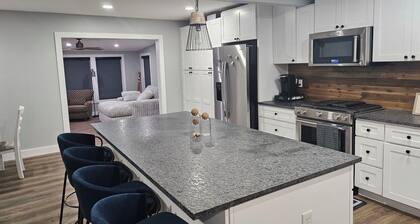 Newly Renovated 1.5 Acre Lake Front Home with Game Room and Direct Lake Access.