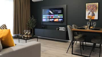 Premium Apartment, Park View | Living area | 65-cm Smart TV with cable channels, Netflix, streaming services