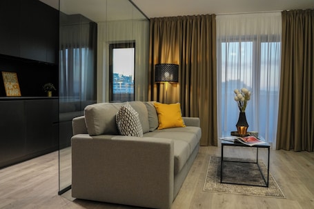 Premium Apartment, Park View | Living area | 65-cm Smart TV with cable channels, Netflix, streaming services