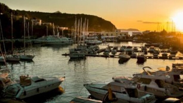 A marina with boats docked at the pier. - 1 Bedroom Apartment in Procida (Procida)