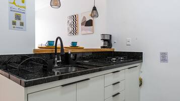 Fridge, microwave, stovetop, coffee/tea maker