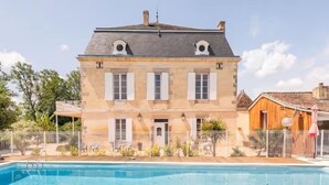 A large, two-story building with a swimming pool in front. - Domaine De l Ourbise  (Razimet)