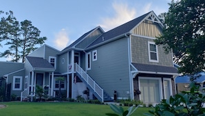 A two-story house with a front porch, a staircase, and a garage. - Edgewater Pirates Den. Water Front 2nd story apt.  1 bedroom, bath & kitchen.
 (Hertford)