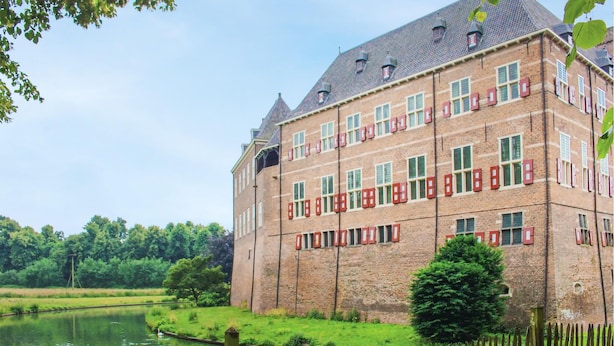 A large brick building with multiple windows and a pond in front. - Nice home in Kilder with kitchen (Kilder)