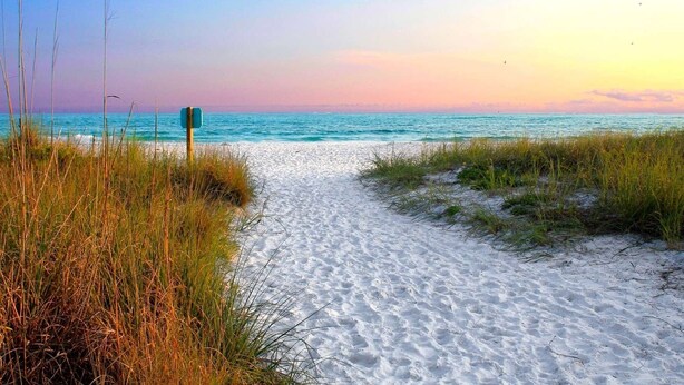 A beach path leading to the ocean with a signpost. - Cozy Getaway Home Near Siesta Key Beach  (Sarasota)