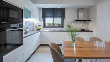 Suite, 2 Bedrooms | Private kitchen | Full-size fridge, microwave, oven, stovetop