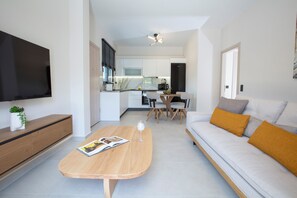 Junior Suite, Private Pool | Living area | 50-inch LED TV with premium channels - Pomaria Boutique Residences  (Lefkada)