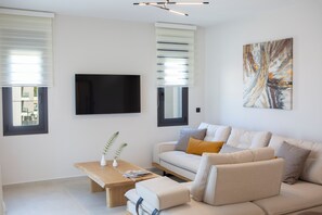 Suite, 2 Bedrooms | Living area | 50-inch LED TV with premium channels - Pomaria Boutique Residences  (Lefkada)