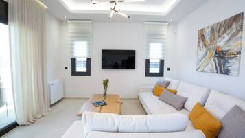 Suite, Private Pool | Living area | 50-inch LED TV with premium channels