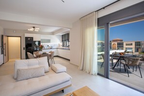 Suite, 2 Bedrooms | Living area | 50-inch LED TV with premium TV channels - Pomaria Boutique Residences  (Lefkada)