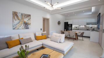 Suite, Private Pool | Living area | 50-inch LED TV with premium channels