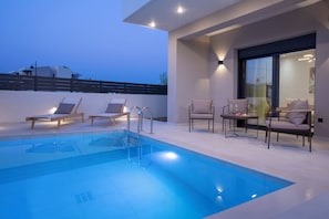 Suite, Private Pool | Living area | 50-inch LED TV with premium channels