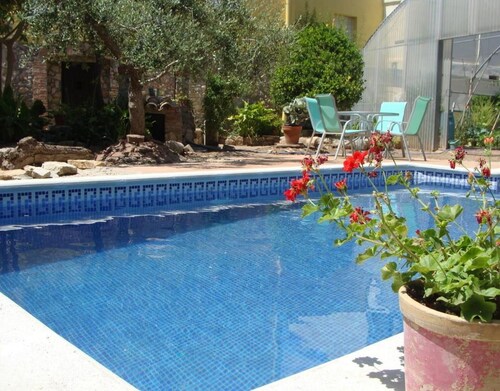 Casa de vacaciones 'Hort De La Cinteta' con vistas a la montaña, piscina y aire acondicionado