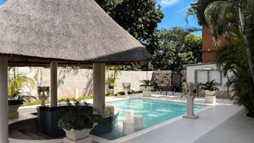 Outdoor pool, pool umbrellas, pool loungers