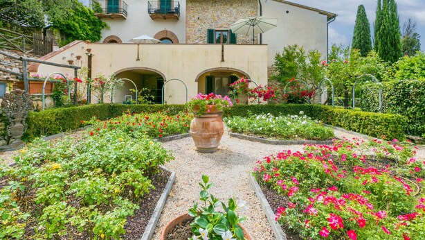 A two-story building with a garden in front. - Le Monache - intero nucleo by Interhome (Montaione)