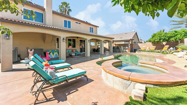A house with a swimming pool, lounge chairs, and a patio area. - Desert Oasis w/Pool, Spa & more! (Coachella)