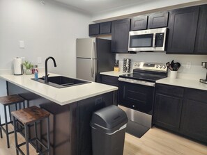 Fridge, microwave, oven, stovetop - Condo at Stadium Place (Manhattan)