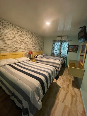 Habitación familiar | Sábanas italianas Frette y ropa de cama de alta calidad