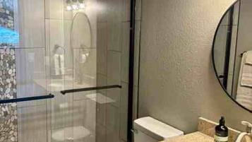 Shower, hair dryer, towels, soap