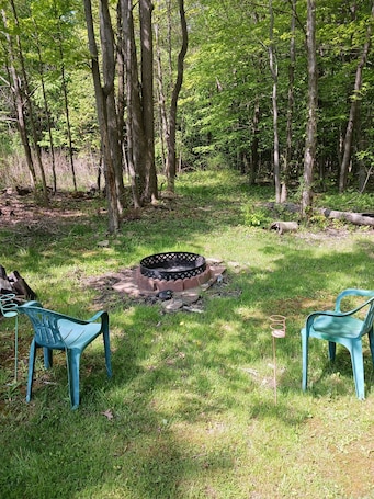 Property grounds. Comfortable Camper a few miles off thruway and area attractions. Fire ring wood