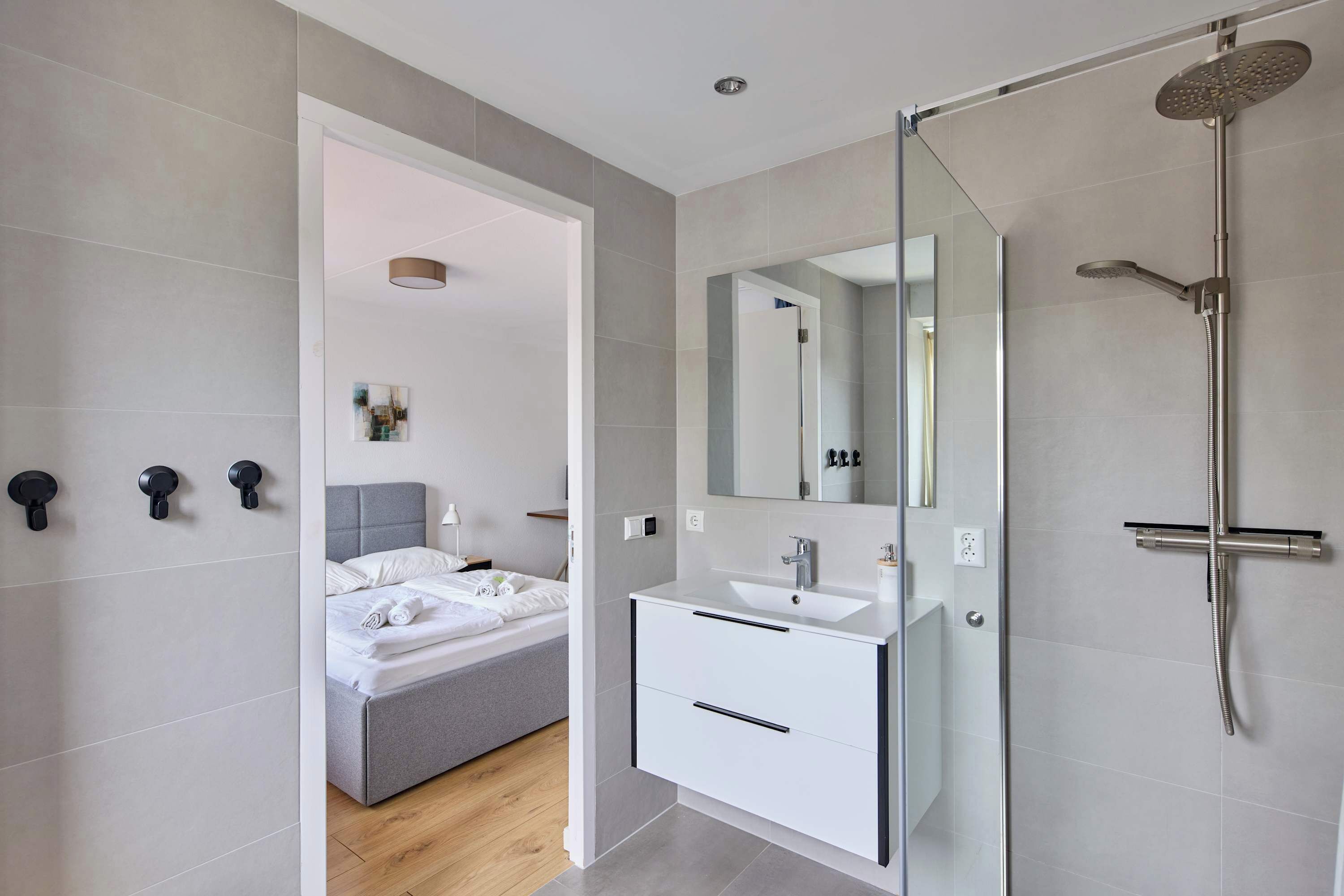 Shower, hair dryer, towels, toilet paper