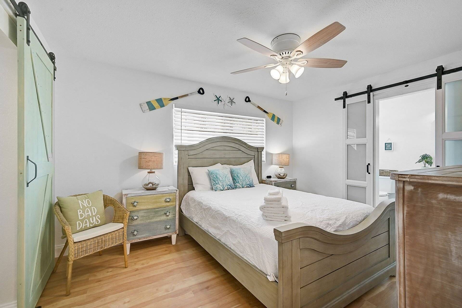 This guest bedroom offers ultimate privacy and comfort, featuring its own en-suite full bathroom for a seamless stay.