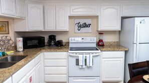 Condo, Multiple Beds, Balcony, Garden View | Private kitchen | Fridge, microwave, oven, stovetop
